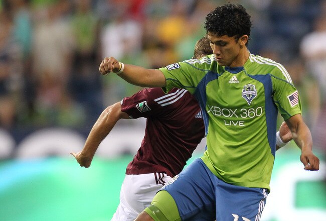 SEATTLE - JULY 25:  Fredy Montero #17 of the Seattle Sounders FC battles Drew Moor #3 of the Colorado Rapids on July 25, 2010 at Qwest Field in Seattle, Washington. (Photo by Otto Greule Jr/Getty Images)