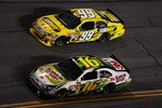 DAYTONA BEACH, FL - JULY 03:  Carl Edwards, driver of the #99 SUBWAY Ford, and teammate Greg Biffle, driver of the #16 3M Scotch-Brite Ford, race side by side during the NASCAR Sprint Cup Series Coke Zero 400 at Daytona International Speedway on July 3, 2010 in Daytona Beach, Florida.  (Photo by John Harrelson/Getty Images for NASCAR)