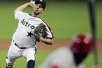 HOUSTON - JULY 24:  Pitcher Roy Oswalt #44 of the Houston Astros throws against the Cincinnati Reds in the first inning at Minute Maid Park on July 24, 2010 in Houston, Texas.  (Photo by Bob Levey/Getty Images)