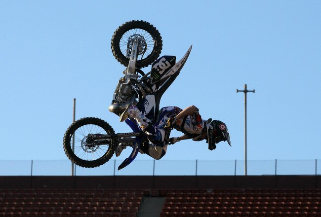 LOS ANGELES, CA - JULY 29:  Nate Adams performs a stunt during the Moto X Freestyle Final at the Los Angeles Coliseum during X Games 16 on July 29, 2010 in Los Angeles, California.  (Photo by Stephen Dunn/Getty Images)