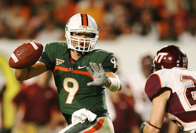 MIAMI - NOVEMBER 13:  Quarterback Robert Marve #9 of the Miami Hurricanes scrambles away from by linebacker Cody Grimm #26 of the Virginia Tech Hokies at Dolphin Stadium on November 13, 2008 in Miami, Florida.  (Photo by Doug Benc/Getty Images)