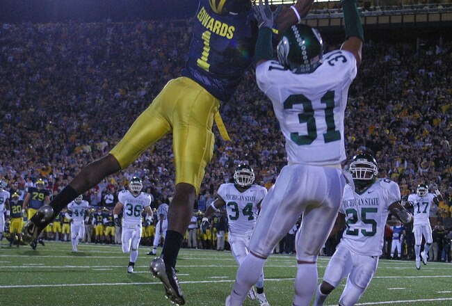 ANN ARBOR - October 30:  Wide receiver Braylon Edwards #1 of Michigan catches a touchdown pass defended by Jaren Hayes #31 of Michigan State at Michigan Stadium on October 30, 2004 in Ann Arbor, Michigan.  The Michigan Wolverines defeated the Michigan State Spartans 45-37.  (Photo by Tom Pidgeon/Getty Images)