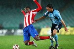 SYDNEY, AUSTRALIA - JULY 28: Maurice Edu of Rangersis tackled by Stuart Musialik of Sydney during the pre-season friendly match between Sydney FC and Glasgow Rangers at the Sydney Football Stadium on July 28, 2010 in Sydney, Australia.  (Photo by Mark Nolan/Getty Images)