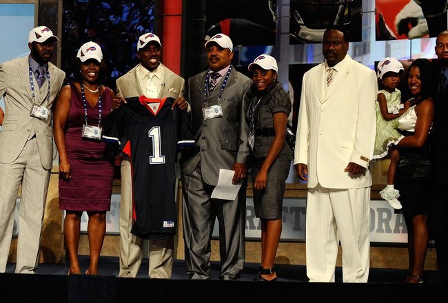 NEW YORK - APRIL 22:  C.J. Spiller from the Clemson Tigers holds up a Buffalo Bills jersey as he poses with friends and family after he was selected number 9 overall by the Bills during the first round of the 2010 NFL Draft at Radio City Music Hall on April 22, 2010 in New York City.  (Photo by Jeff Zelevansky/Getty Images)
