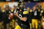 MIAMI GARDENS, FL - JANUARY 05:  Quarterback Richy Stanzi #12 of the Iowa Hawkeyes rolls out of the pocket against the Georgia Tech Yellow Jackets during the FedEx Orange Bowl at Land Shark Stadium on January 5, 2010 in Miami Gardens, Florida. Iowa won 24-14.  (Photo by Marc Serota/Getty Images)