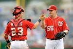 WASHINGTON - JULY 29:  Matt Capps #55 of the Washington Nationals celebrates with Wil Nieves #23 after a 5-3 victory against the Atlanta Braves at Nationals Park on July 29, 2010 in Washington, DC.  (Photo by Greg Fiume/Getty Images)