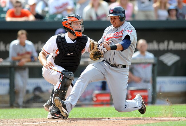 BALTIMORE - MAY 16:  Jhonny Peralta #2 of the Cleveland Indians is tagged out at home plate by Craig Tatum #15 of the Baltimore Orioles at Camden Yards on May 16, 2010 in Baltimore, Maryland.  (Photo by Greg Fiume/Getty Images)
