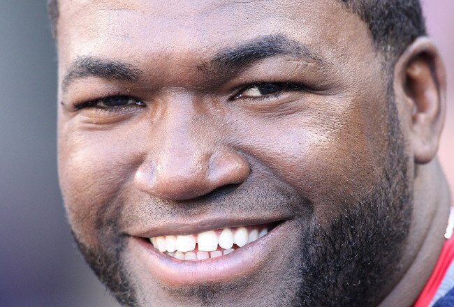 SEATTLE - JULY 24:  David Ortiz #34 of the Boston Red Sox smiles in the dugout prior to the game against the Seattle Mariners at Safeco Field on July 24, 2010 in Seattle, Washington. (Photo by Otto Greule Jr/Getty Images)