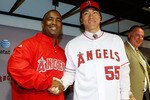 ANAHEIM, CA - DECEMBER 16:  (L-R) Los Angeles Angels of Anaheim general manager Tony Reagins and Hideki Matsui shake hands as manager Mike Scioscia looks on during a press conference at Angel Stadium of Anaheim on December 16, 2009 in Anaheim, California.  (Photo by Jeff Gross/Getty Images)