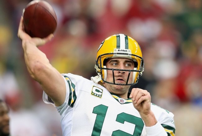 GLENDALE, AZ - JANUARY 10:  Quarterback Aaron Rodgers #12 of the Green Bay Packers warms up before the 2010 NFC wild-card playoff game against the Arizona Cardinals at the Universtity of Phoenix Stadium on January 10, 2010 in Glendale, Arizona.  The Cardinals defeated the Packers  51-45 in overtime.  (Photo by Christian Petersen/Getty Images)