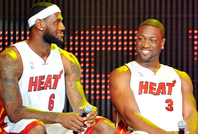 MIAMI - JULY 09:   LeBron James #6, Dwyane Wade #3 and Chris Bosh #1 of the Miami Heat speak after being introduced to fans during a welcome party at American Airlines Arena on July 9, 2010 in Miami, Florida.  (Photo by Doug Benc/Getty Images)
