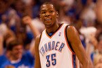 OKLAHOMA CITY - APRIL 22: Kevin Durant #35 of the Oklahoma City Thunder smiles after hitting a three-point shot against the Los Angeles Lakers during Game Three of the Western Conference Quarterfinals of the 2010 NBA Playoffs on April 22, 2010 at the Ford Center in Oklahoma City, Oklahoma.  NOTE TO USER: User expressly acknowledges and agrees that, by downloading and or using this photograph, User is consenting to the terms and conditions of the Getty Images License Agreement.  (Photo by Dilip Vishwanat/Getty Images)