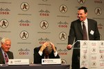 FREMONT, CA - NOVEMBER 14: Oakland Athletics general manager Billy Beane (R) speaks at a press conference with Lew Wolff (L) owner and managing partner of the Oakland Athletics and Major League Baseball Commisioner Bud Selig announcing the building of a new ballpark in Fremont, California, on land owned by Cisco Systems, at their headquarters on November 14, 2006 in San Jose, California. The Oakland A's will purchase the land from Cisco and have sold the naming rights for the new ballpark to Cisco Systems Inc.  (Photo by Jed Jacobsohn/Getty Images)