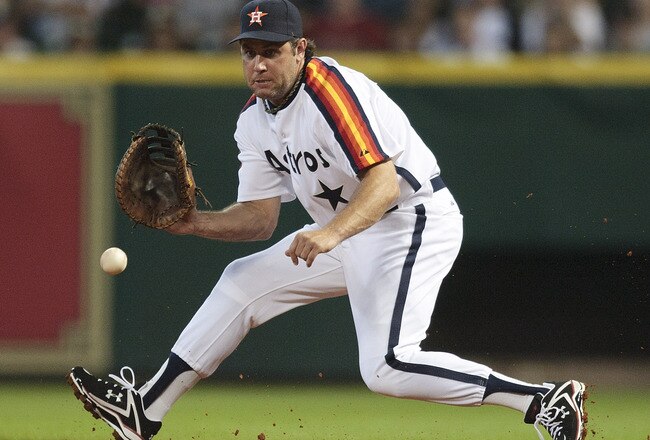 HOUSTON - JULY 24:  First baseman Lance Berkman #17 makes a play atr first base against the Cincinnati Reds at Minute Maid Park on July 24, 2010 in Houston, Texas.  (Photo by Bob Levey/Getty Images)