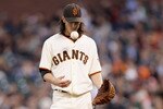 SAN FRANCISCO - JULY 15:  Tim Lincecum #55 of the San Francisco Giants pitches against the New York Mets in the second inning at AT&T Park on July 15, 2010 in San Francisco, California.  (Photo by Ezra Shaw/Getty Images)
