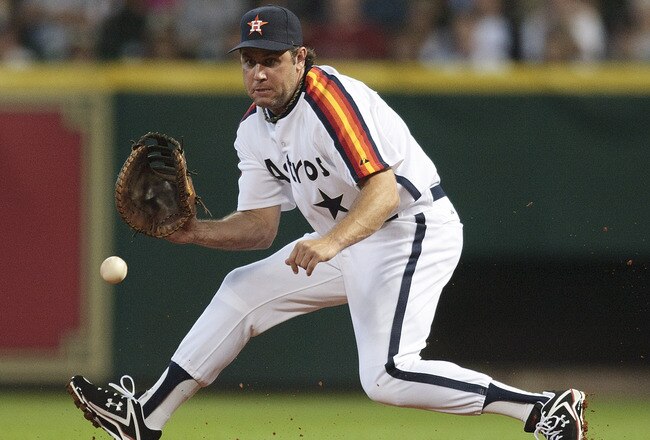 HOUSTON - JULY 24:  First baseman Lance Berkman #17 makes a play atr first base against the Cincinnati Reds at Minute Maid Park on July 24, 2010 in Houston, Texas.  (Photo by Bob Levey/Getty Images)