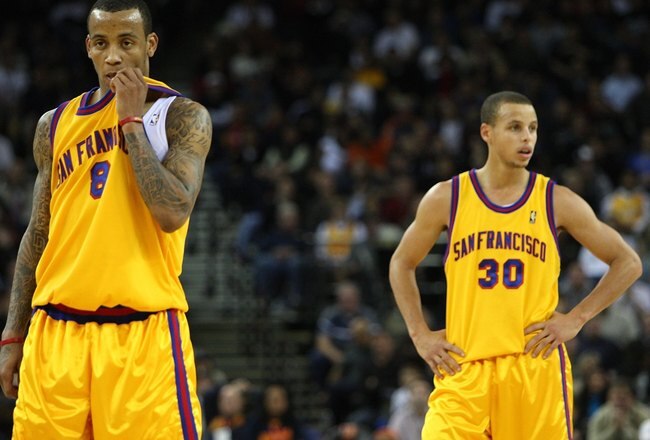 OAKLAND, CA - DECEMBER 03:  Stephen Curry #30 and Monta Ellis #8 of the Golden State Warriors look on near the end of the game against the Houston Rockets during an NBA game at Oracle Arena on December 3, 2009 in Oakland, California. NOTE TO USER: User expressly acknowledges and agrees that, by downloading and/or using this Photograph, user is consenting to the terms and conditions of the Getty Images License Agreement.  (Photo by Jed Jacobsohn/Getty Images)
