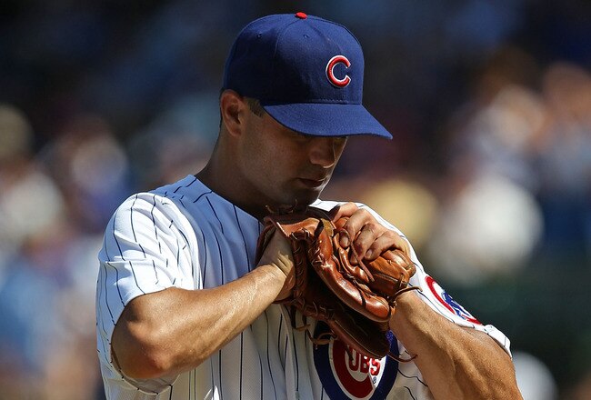 CHICAGO - JULY 21: Starting pitcher Ted Lilly #30 of the Chicago Cubs reacts as he leaves a game against the Houston Astros in the 8th inning at Wrigley Field on July 21, 2010 in Chicago, Illinois. The Astros defeated the Cubs 4-3 in 12 innings. (Photo by Jonathan Daniel/Getty Images)