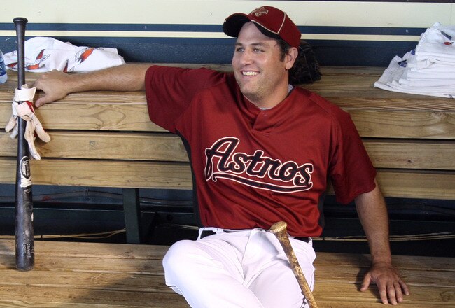 HOUSTON - JULY 30:  First baseman Lance Berkman of the Houston Astros sits in the dugout during batting practice before the Milwaukee Brewers play the Houston Astros at Minute Maid Park on July 30, 2010 in Houston, Texas.  (Photo by Bob Levey/Getty Images)