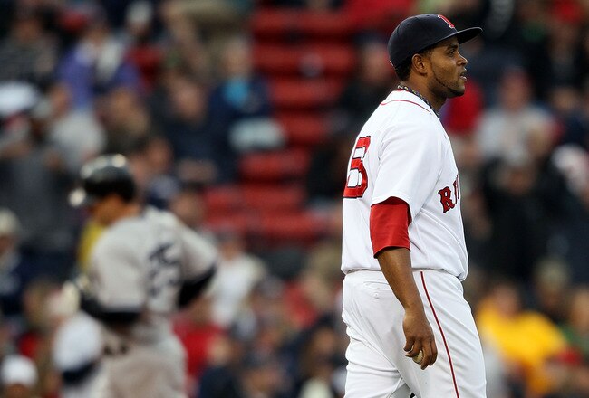BOSTON - MAY 08:  Ramon Ramirez #56 of the Boston Red Sox reacts as Mark Teixeira #25 of the New York Yankees rounds third after a solo home run in the seventh inning on May 8, 2010 at Fenway Park in Boston, Massachusetts.  (Photo by Elsa/Getty Images)
