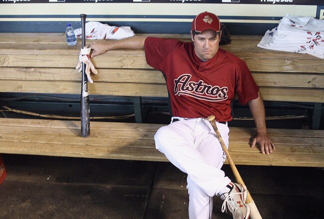 HOUSTON - JULY 30:  First baseman Lance Berkman of the Houston Astros sits in the dugout during batting practice before the Milwaukee Brewers play the Houston Astros at Minute Maid Park on July 30, 2010 in Houston, Texas.  (Photo by Bob Levey/Getty Images)