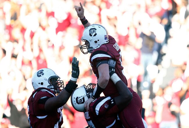 COLUMBIA, SC - NOVEMBER 28:  Stephen Garcia #5 of the South Carolina Gamecocks celebrates a second half touchdown with his temmates against the Clemson Tigers at Williams-Brice Stadium on November 28, 2009 in Columbia, South Carolina.  (Photo by Scott Halleran/Getty Images)