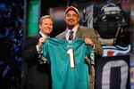 NEW YORK - APRIL 22:  Jared Odrick (R) from Penn State poses with NFL Commissioner Roger Goodell as they hold up a Miami Dolphins jersey after the Dolphins selected Odrick number 28 overall during the first round of the 2010 NFL Draft at Radio City Music Hall on April 22, 2010 in New York City.  (Photo by Jeff Zelevansky/Getty Images)