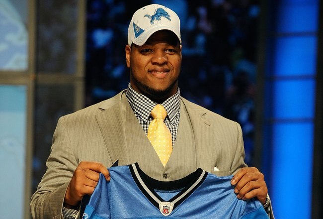NEW YORK - APRIL 22:  Ndamukong Suh from the Nebraska Cornhuskers holds up a Detroit Lions jersey after Suh was selected by the Lions number 2 overall during the first round of the 2010 NFL Draft at Radio City Music Hall on April 22, 2010 in New York City.  (Photo by Jeff Zelevansky/Getty Images)
