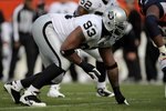 DENVER - NOVEMBER 23:  Defensive tackle Tommy Kelly #93 of the Oakland Raiders defends against the Denver Broncos during week 12 NFL action at Invesco Field at Mile High on November 23, 2008 in Denver, Colorado. The Raiders defeated the Broncos 31-10.  (Photo by Doug Pensinger/Getty Images)