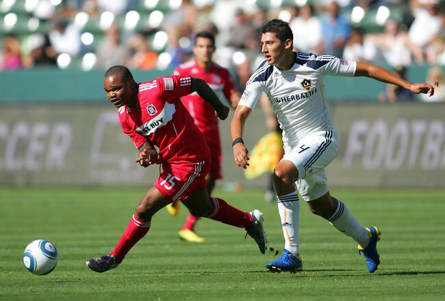 CARSON, CA - AUGUST 01:  Collins John #15 of the Chicago Fire vies for position to the ball past Omar Gonzalez #4 of the Los Angeles Galaxy in the first half during their MLS match at The Home Depot Center on August 1, 2010 in Carson, California.  (Photo by Victor Decolongon/Getty Images)