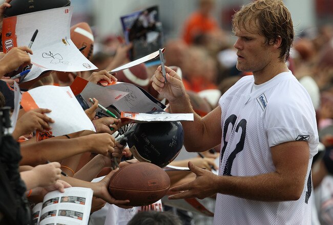 BOURBONNAIS, IL - JULY 30: Greg Olsen #82 of the Chicago Bears signs autographs for fans following a summer training camp practice at Olivet Nazarene University on July 30, 2010 in Bourbonnais, Illinois. (Photo by Jonathan Daniel/Getty Images)