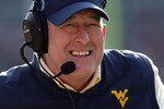 JACKSONVILLE, FL - JANUARY 01:  Head coach Bill Stewart of the West Virginia Mountaineers watches his team take on the Florida State Seminoles during the Konica Minolta Gator Bowl on January 1, 2010 at Jacksonville Municipal Stadium in Jacksonville, Florida. Florida State defeated West Virginia 33-21 in Bobby Bowden's last game as a head coach for the Seminoles.  (Photo by Doug Benc/Getty Images)