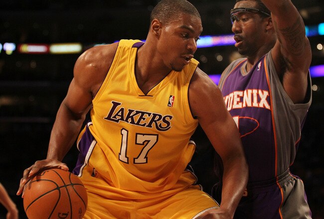 LOS ANGELES, CA - MAY 27:  Andrew Bynum #17 of the Los Angeles Lakers drives with the ball against Amar'e Stoudemire #1 of the Phoenix Suns in the first quarter of Game Five of the Western Conference Finals during the 2010 NBA Playoffs at Staples Center on May 27, 2010 in Los Angeles, California. NOTE TO USER: User expressly acknowledges and agrees that, by downloading and/or using this Photograph, user is consenting to the terms and conditions of the Getty Images License Agreement.  (Photo by Jeff Gross/Getty Images)