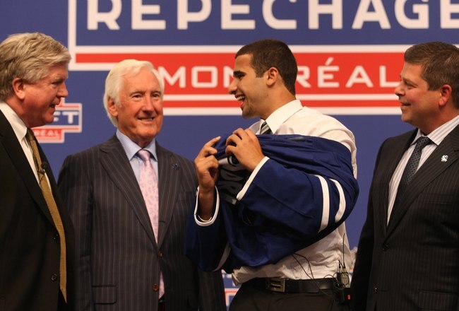 MONTREAL - JUNE 26:  (L-R)  Toronto Maple Leafs President & GM Brian Burke, Special Advisor Cliff Fletcher, First Round Draft Pick Nazem Kadri and Senior VP of Hockey Operations Dave Nonis stand on the stage during the first round of the 2009 NHL Entry Draft at the Bell Centre on June 26, 2009 in Montreal, Quebec, Canada. (Photo by Bruce Bennett/Getty Images)