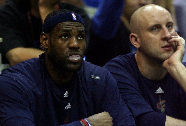 ORLANDO, FL - MAY 26:  LeBron James #23 and Zydrunas Ilgauskas #11 of the Cleveland Cavaliers look on from the bench during the game against the Orlando Magic in Game Four of the Eastern Conference Finals during the 2009 NBA Playoffs at the Amway Arena on May 26, 2009 in Orlando, Florida. NOTE TO USER: User expressly acknowledges and agrees that, by downloading and or using this photograph, User is consenting to the terms and conditions of the Getty Images License Agreement.  (Photo by Elsa/Getty Images)