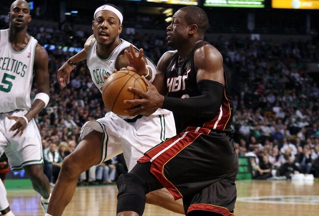 BOSTON - APRIL 27:  Dwyane Wade #3 of the Miami Heat heads for the net as Paul Pierce #34 of the Boston Celtics defends during Game Five of the Eastern Conference Quarterfinals of the 2010 NBA playoffs at the TD Garden on April 27, 2010 in Boston, Massachusetts. The Celtics defeated the Heat 96-86 to win the series. NOTE TO USER: User expressly acknowledges and agrees that, by downloading and or using this photograph, User is consenting to the terms and conditions of the Getty Images License Agreement.  (Photo by Elsa/Getty Images)