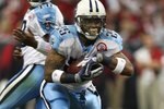 HOUSTON - NOVEMBER 23:  Running back LenDale White #25 of the Tennessee Titans carries the all against the Houston Texans on November 23, 2009  at Reliant Stadium in Houston, Texas.  (Photo by Stephen Dunn/Getty Images)