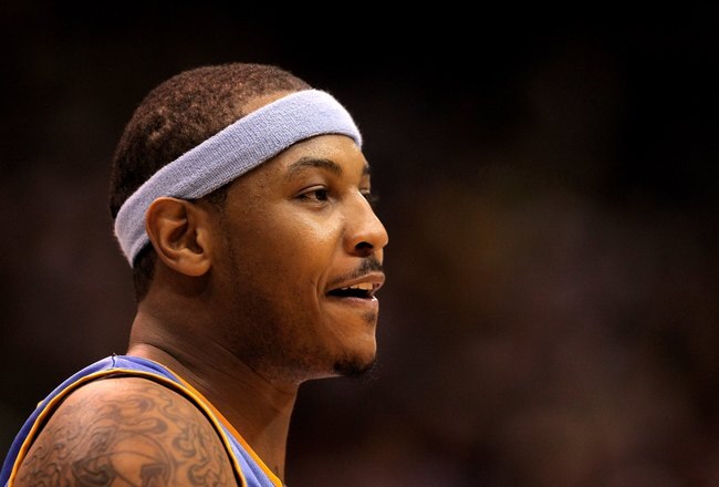 SALT LAKE CITY - APRIL 30:  Carmelo Anthony #15 of the Denver Nuggets stands on the court during their game against the Utah Jazz in Game Six of the Western Conference Quarterfinals of the 2010 NBA Playoffs at EnergySolutions Arena on April 30, 2010 in Salt Lake City, Utah. NOTE TO USER: User expressly acknowledges and agrees that, by downloading and or using this photograph, User is consenting to the terms and conditions of the Getty Images License Agreement.  (Photo by Ezra Shaw/Getty Images)