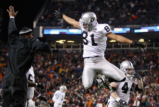 DENVER - DECEMBER 20:  Chaz Schilens #81 of the Oakland Raiders is congratulated by Javon Walker (L) after scoring a touchdown late in the fourth quarter against the Denver Broncos at Invesco Field at Mile High on December 20, 2009 in Denver, Colorado. The Raiders defeated the Broncos 20-19.  (Photo by Jeff Gross/Getty Images)