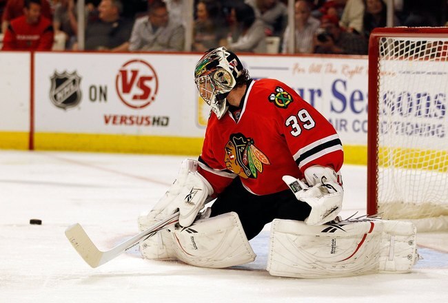 CHICAGO - MAY 01: Cristobal Huet #39 of the Chicago Blackhawks knocks the puck away against the Vancouver Canucks in Game One of the Western Conference Semifinals during the 2010 NHL Stanley Cup Playoffs at United Center on May 1, 2010 in Chicago, Illinois. The Canucks defeated the Blackhawks 5-1. (Photo by Jonathan Daniel/Getty Images)