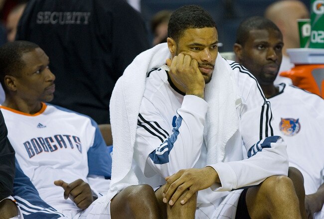 CHARLOTTE, NC - APRIL 26:  (L-R) Theo Ratliff #42, Tyson Chandler #6 and Nazr Mohammed #13 of the Charlotte Bobcats sit on the bench during the final minutes of their game against the Orlando Magic in Game Four of the Eastern Conference Quarterfinals during the 2010 NBA Playoffs at Time Warner Cable Arena on April 26, 2010 in Charlotte, North Carolina. The Magic defeated the Bobcats 99-90 to complete the 4-game sweep.  NOTE TO USER: User expressly acknowledges and agrees that, by downloading and or using this photograph, User is consenting to the terms and conditions of the Getty Images License Agreement. (Photo by Brian A. Westerholt/Getty Images)