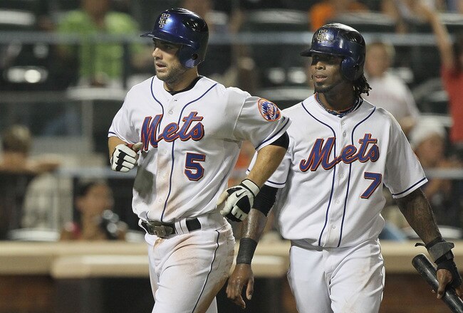 NEW YORK - JULY 06:  Jose Reyes #7 and David Wright #5 of the New York Mets celebrate after scoring in the sixth inning against the Cincinnati Reds on July 6, 2010 at Citi Field in the Flushing neighborhood of the Queens borough of New York City.  (Photo by Jim McIsaac/Getty Images)