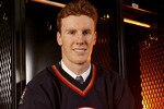 COLUMBUS, OH - JUNE 22:  21th overall pick Riley Nash of the Edmonton Oilers poses onstage with team personnel during the first round of the 2007 NHL Entry Draft at Nationwide Arena on June 22, 2007 in Columbus, Ohio.  (Photo by Gregory Shamus/Getty Images)