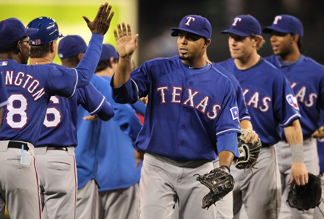SEATTLE - AUGUST 05:  Nelson Cruz #17 of the Texas Rangers celebrates with teammates after defeating the Seattle Mariners 6-0 at Safeco Field on August 5, 2010 in Seattle, Washington. (Photo by Otto Greule Jr/Getty Images)