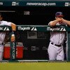 CLEVELAND - JULY 29:  Members of the Cleveland Indians stand in the dugout during the game against the New York Yankees on July 29, 2010 at Progressive Field in Cleveland, Ohio.  (Photo by Jared Wickerham/Getty Images)