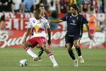 HARRISON, NJ - JULY 22: Theirry Henry #14 of the New York Red Bulls plays the ball while being defended by Niko Kranjcar #21 of Tottenham Hotspur during their game at Red Bull Arena on July 22, 2010 in Harrison, New Jersey. Tottenham Hotspur defeated the Red Bulls 2-1. (Photo by Andy Marlin/Getty Images for the New York Red Bulls)