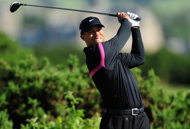 ST ANDREWS, SCOTLAND - JULY 17:  Tiger Woods of the USA tees off on the 10th hole during the third round of the 139th Open Championship on the Old Course, St Andrews on July 17, 2010 in St Andrews, Scotland.  (Photo by Stuart Franklin/Getty Images)