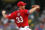 ARLINGTON, TX - JULY 22:  Pitcher Cliff Lee #33 of the Texas Rangers throws against the Los Angeles Angels of Anaheim on July 22, 2010 at Rangers Ballpark in Arlington, Texas.  (Photo by Ronald Martinez/Getty Images)