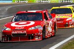 WATKINS GLEN, NY - AUGUST 08:  Juan Pablo Montoya, driver of the #42 Target Chevrolet, leads Marcos Ambrose, driver of the #47 Little Debbie Toyota, around a turn during the NASCAR Sprint Cup Series Heluva Good! Sour Cream Dips at Watkins Glen International on August 8, 2010 in Watkins Glen, New York.  (Photo by Chris Trotman/Getty Images)
