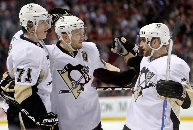 MONTREAL- MAY 4:  Evgeni Malkin #71 of the Pittsburgh Penguins celebrates his third period goal with team mates in Game Three of the Eastern Conference Semifinals against the Montreal Canadiens during the 2010 NHL Stanley Cup Playoffs at the Bell Centre on May 4, 2010 in Montreal, Quebec, Canada.  The Penguins defeated the Canadiens 2-0 taking a 2-1 lead in the series.  (Photo by Richard Wolowicz/Getty Images)